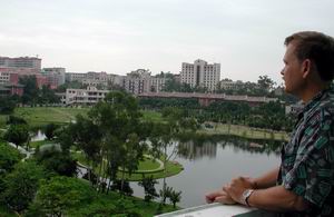 Dr Bill overlooking Xiamen University's Furong Lake from the balcony of the MBA Building