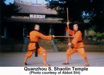 Two S. Shaolin monks battling with poles in front of Quanzhou's Southern Shaolin Temple.  Photo courtesy of Abbot Shi Changding